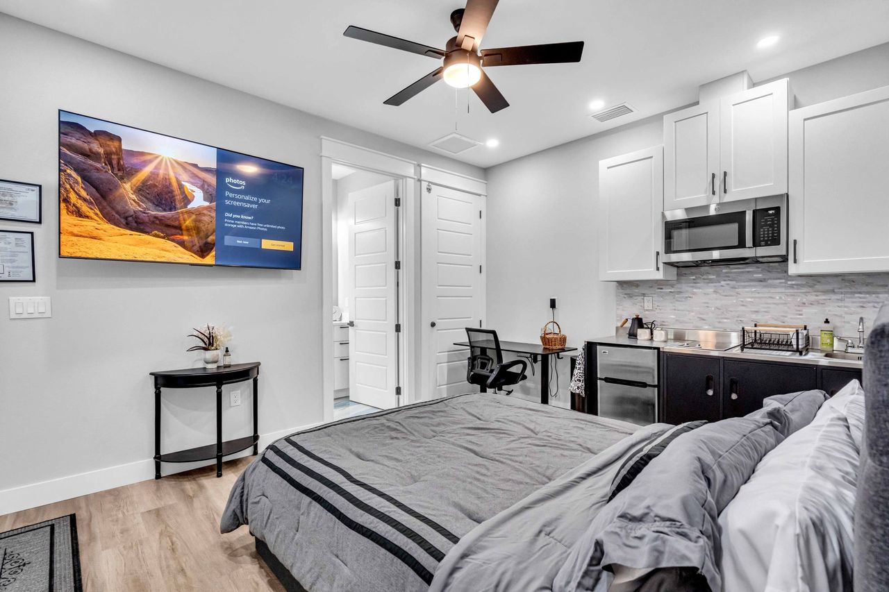 Queen Bed with extra twin bed that slides out for an additional sleeping space. Work desk with adjustable height feature