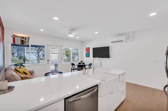 Apron sink set in a large kitchen island.