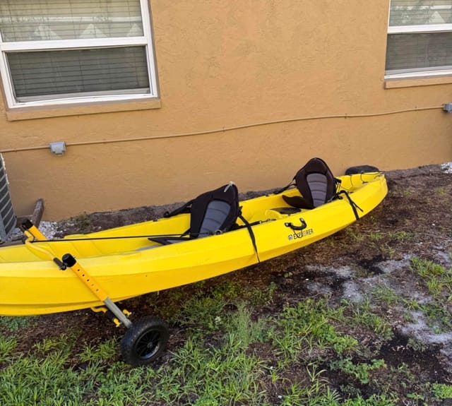 Enjoy the Big Banana that seats Up to 2 Adults and 1 child Kayak Launch 100 steps away from the Home Kayak cart included