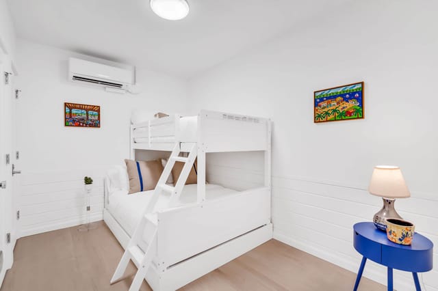 2nd bedroom with twin over full bunkbed and closet for storage.