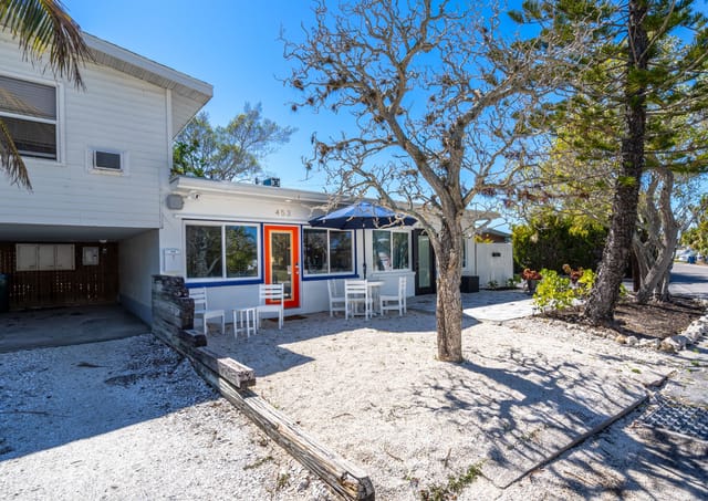 Front patio area with outdoor dining for 4 and a picturesque spot to enjoy your morning coffee. Can see the bay from the