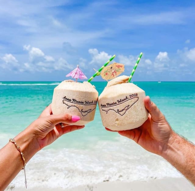 Plan to grab a coconut, set up your beach chair and put your feet in the white sands of Anna Maria Island. Cheers to a r