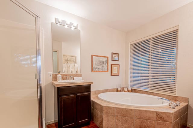 Master Bedroom with a deep soaking tub to unwind after days long adventure