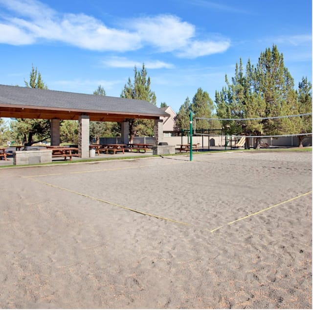Volleyball court, picnic tables, grills and a playground within walking distance from our home.