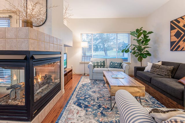 Living room with townhouse comfort, space to watch your favorite show, and warmth from the beautiful gas fireplace.