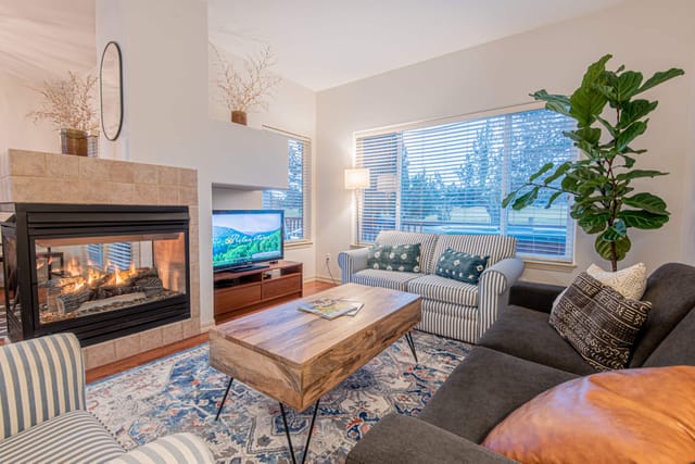 Enjoy the comfiest spot in the house with a gas fireplace, your favorite TV show, and views out to the greens.
