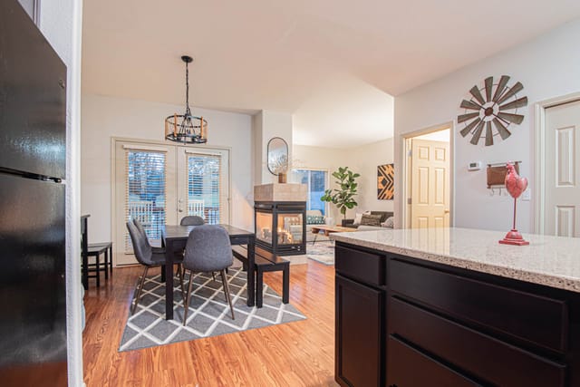 Spacious kitchen area with everything you need to prepare meals while looking onto the green