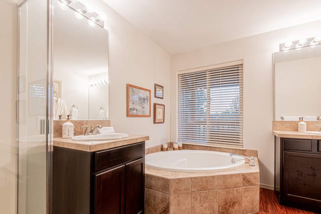 Master ensuite bathroom with walk in shower, soaking tub and walk in closet