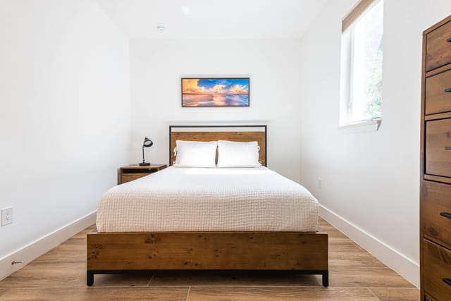 3rd Master- bedroom with comfortable bed and plenty of storage around the room