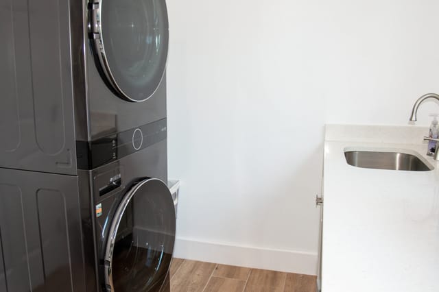 Laundry room off kitchen for the convenience of doing laundry while staying in the home.