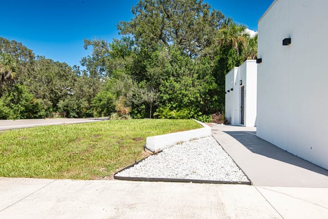 Spacious walkway to the front door. stunning landscape.