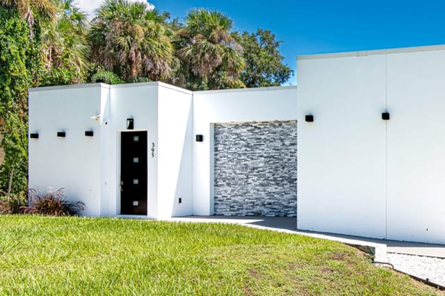 Driveway with space for up to 3 vehicles and a garage for parking one small sized vehicle.