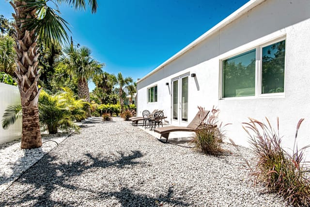 Enjoy your sun tan while you lay on the lounge chairs in the back of the house.