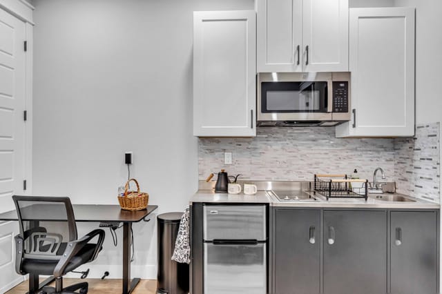 Full mother-in-law kitchen with a Keurig, pods, and teas