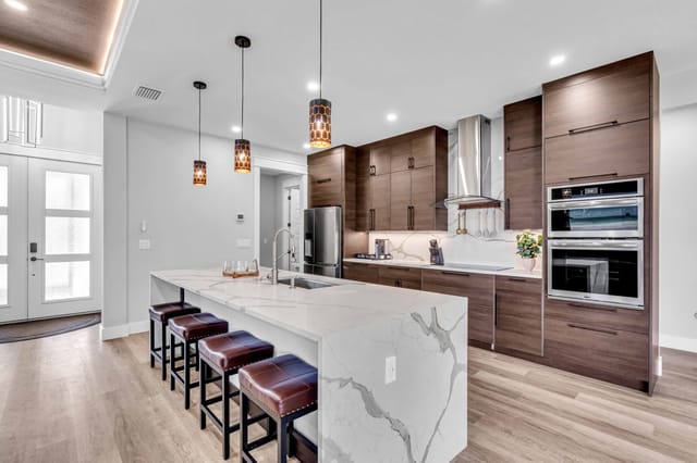 Beautiful waterfall island with comfortable bar seating for casual meals