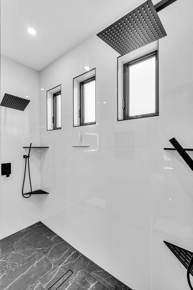 Modern shower area with lots lighting and space