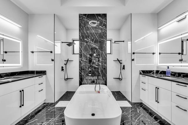 Stunning marble bathroom with double vanities for all your morning preparations.