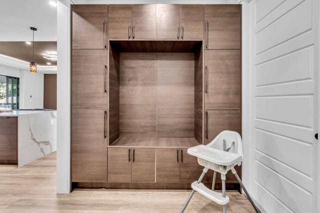 Perfect cubby area for holding groceries and stocked with books and toys for children