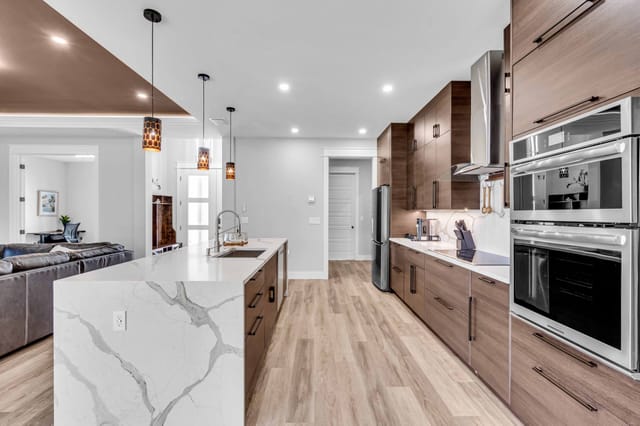 Fully stocked kitchen for comfortable cooking with pull out trash cans