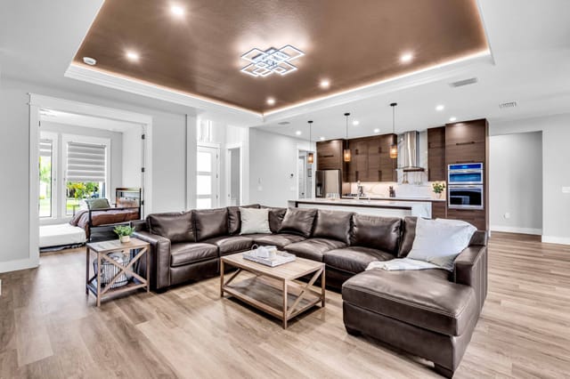 large sectional with seating for 7 plus a comfy leather chair (not pictured) in an open spacious living area