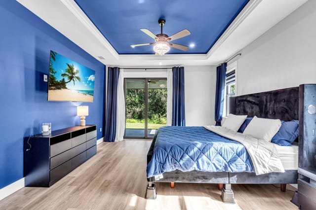 King bed with large TV and leather sitting chair (not pictured). Room darkening shades as well as black-out curtains and