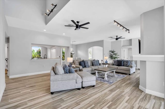 Modern coastal living area with dimmable stage lights