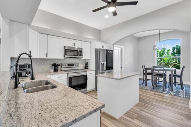 Modern designed kitchen with space to enjoy a cup of coffee while sitting in the dining area or around the island