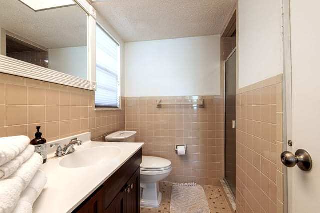 Second master bathroom with shower and linen closet